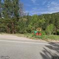 Two cars racing downhill on Lefthand Canyon Drive