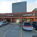 Injured person covered in blood outside restaurant
