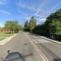 Low branches causing road hazard on Howell Drive