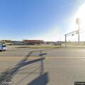 Person experiencing breathing difficulty at gas station