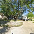 Person returns and sits outside Champaign home