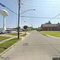 Person experiencing cardiac emergency at 33 Harrison Ave