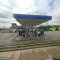 Man passed out inside blue vehicle at gas pumps