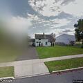 Person experiencing abdominal pain near Levittown