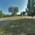 Officer checks vehicle at state park boat ramp