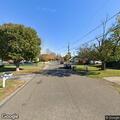Brush fire on power lines behind Pine Avenue home