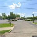 Person experiencing breathing difficulty at Pizza King