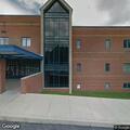 Person with breathing problem at school parking lot