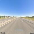 Two vehicles stopped on roadside near Highway 85