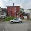 CO alarm and person having trouble breathing