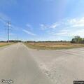 Suspicious van left in field near intersection