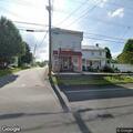 Vehicle hits building and leaves scene in Woodbury