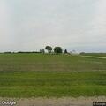 Vehicle or farm vehicle fire in field near Gifford