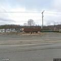 Intoxicated woman vomiting near roadway with family