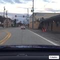 Male falls from bike trapping leg under it on South Main St