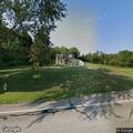 Disabled tractor-trailer in front of residence