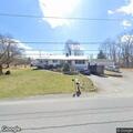 Propane tank fire on porch threatens home