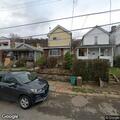 Neighbors disputing over parking spot trash can