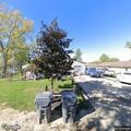 Suspicious man sitting in car outside Elm Street home