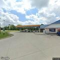 Object from vehicle damages car at gas station