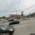 Car hits pole at auto sales lot, driver has minor wounds