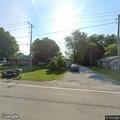 Woman damaging car and property in driveway