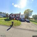Man aged 50 reports chest pain at residence