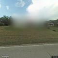 Dirt bikes racing on road near Main Street home