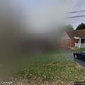 Suspicious man repeatedly covering his face