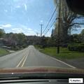 Driver nearly hits caller while drinking from bottle