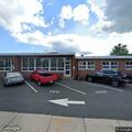 Person with back pain at police headquarters in Matawan