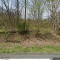 Large tree branch partially blocking roadway