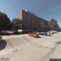 Man experiencing stomach pain at residence hall
