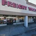 Person sleeping in vehicle at store parking lot