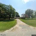 Power line hanging over driveway at residence