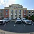 Person experiencing chest pain at hotel room