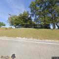 Car leaves highway and crashes into ditch and timber