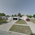 Person experiencing abdominal pain near Highland Drive, Bloomington