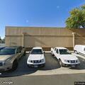 Officer contacts wanted probationer near auto shop