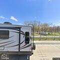 Dog locked in camper reported at trailer lot