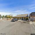 Man lying inside laundromat, appears intoxicated