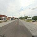 Suspicious vehicle and calf along highway