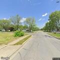 Elderly woman with walker seen unassisted at home