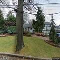 Tree limb caught in overhead telephone wires