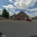 Person stopped behind wheel at bank needs help