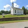 Person with actively bleeding head wound treated at church