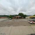 Tractor trailers tangled in wires near pizza shop