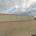 Masked people near dumpsters at Dollar General