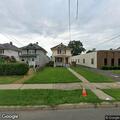 Neighbor spray paints company easement on Main Street