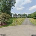 Neighbor riding quad around neighborhood